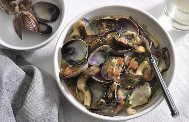 Manila Clams and Oyster Mushrooms in a white bowl